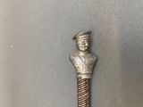 a metal object that has a man on top of it