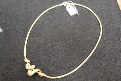 gold plated necklace with three hearts and a heart charm