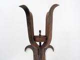 a wooden candle holder with a candle inside of it