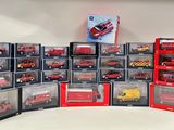 a lot of red and yellow firetrucks in a display case