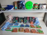 a lot of toys on a shelf next to a stuffed animal