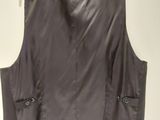 an image of a black leather vest on a hanger