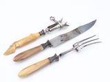 three different types of garden tools on a white surface