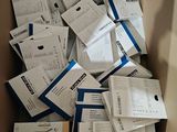 a cardboard box full of white and blue papers