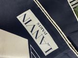 a black and white bag with a label on it