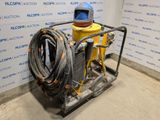 an image of a machine with hoses in a room