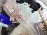 many items in a plastic bag on the floor