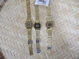 two watches that are sitting on top of a basket