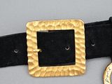 a close up of a belt with a gold buckle on it