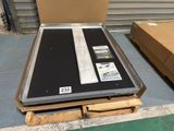 a large metal box with a black and white label on it