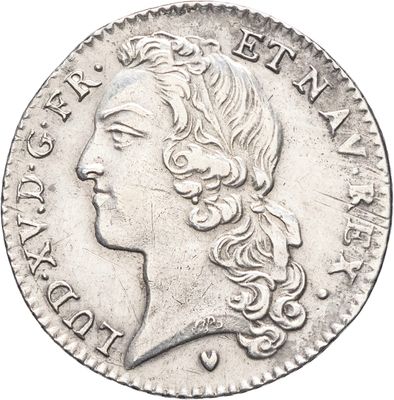 gros plan d'une pièce de monnaie sur laquelle figure un visage de femme