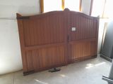a refrigerator and a refrigerator freezer in a garage
