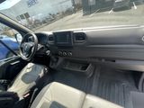 the interior of a car with a steering wheel and dashboard controls