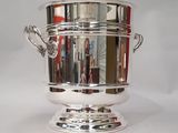 a silver cup that is sitting on a table