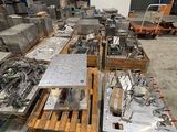 a large amount of metal items on pallets in a warehouse