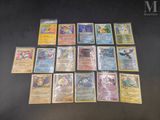 a lot of pokemon cards that are on the table