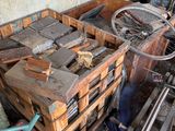 a pile of wooden crates and a bicycle in a room