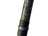 a close up of a pen with a mosaic pattern on it