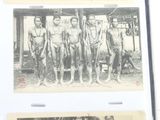 an old photo of a group of men in uniform posing for a picture