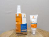 a bottle of sunscreen and a tube of lotion on a table
