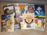 a lot of movie posters on the floor