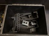 a bunch of metal parts in a box on a table