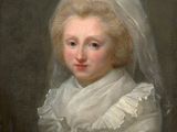 portrait of a young girl in a white dress with a veil