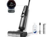 un aspirateur noir et argenté, avec une brosse à dents et du dentifrice