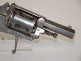 an old gun that is on display on a table