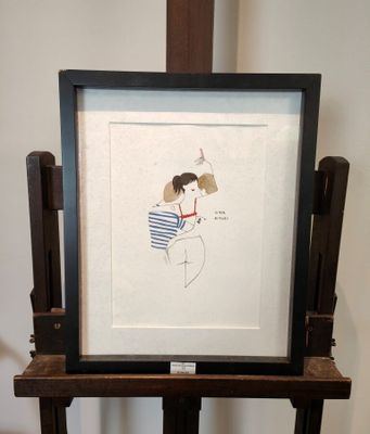 la photo d'un tableau représentant une femme en robe, posé sur un chevalet