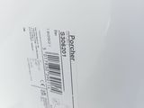 a close up of the back of a white toilet with a label on it
