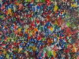 an abstract painting of many colors of paint on a white surface