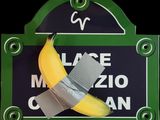 a picture of a banana taped to a sign