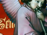 a painting of an angel with a trumpet in his hand