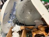 a wooden box filled with assorted items on a table