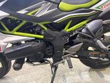 a close up of a motorcycle parked in a showroom