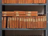 a lot of books on the shelves in the room