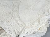 a close up of a piece of lace on a table