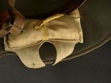 a brown hat with a brown belt and a brown bag