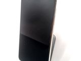 a cell phone that is sitting on top of a stand