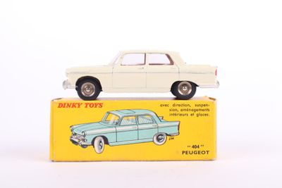 a white toy car sitting on top of a box