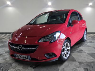 a picture of a red opel car parked in a garage
