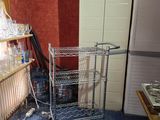 an image of a kitchen with a rack of wine glasses