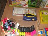 a table with a lot of school supplies on it
