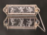 an antique silver and glass box with a picture of a man and woman on it