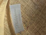 a label on the back of a bag that is sitting on a red chair