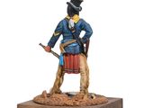 the figurine of a man in a blue coat and hat is holding a rifle