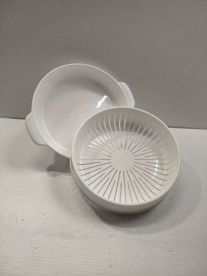 a white bowl and a white bowl on a table