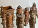 many vases that are sitting on a glass table