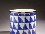 an image of a blue and white cup sitting on top of a table